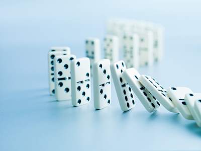 a row of dominos falling.