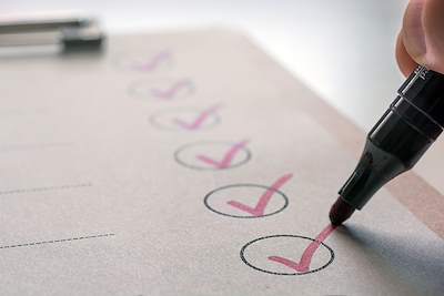clipboard with a checklist and pen.